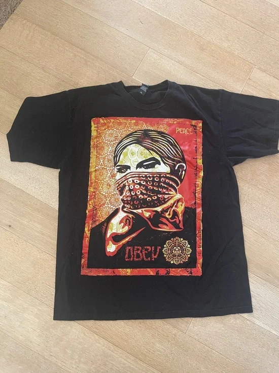 Obey Shepherd Fairy - Black Short Sleeve Tee with Red & Yellow Graphic - Picture 1 of 8